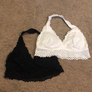 two bralettes, black and white/cream. fits size M